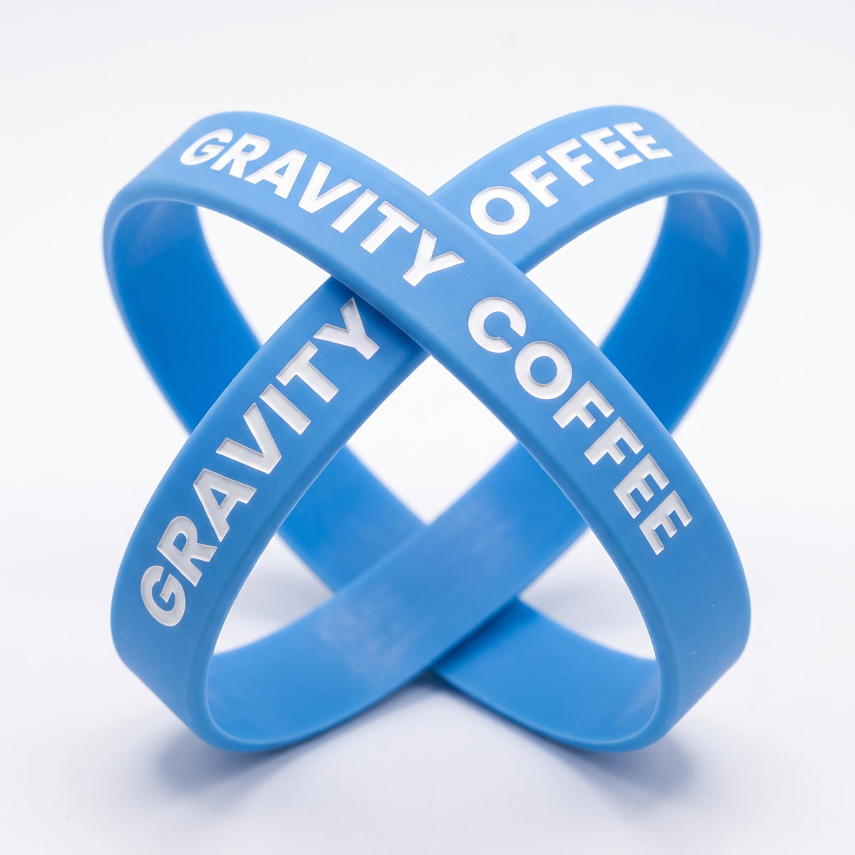 Baby blue wristbands with white Gravity Coffee lettering