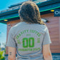 Person wearing a 'Gravity Coffee USA' t-shirt with 'Washington State' text outdoors.